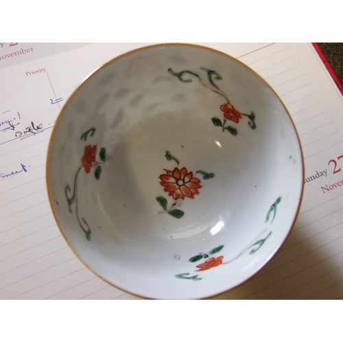 354 - A Chinese Kang Hsi period famille verte tea bowl decorated with flowering lotus plants.... 