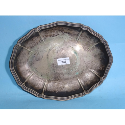 738 - An oval white metal serving dish with German 835 marks and other metal ware.