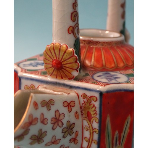 343 - A Japanese Imari porcelain sake kettle with overhead handle c1900.