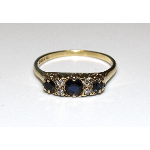 337 - A 9ct gold ring set three sapphires, with pairs of diamonds between, size Q, 2.4g.