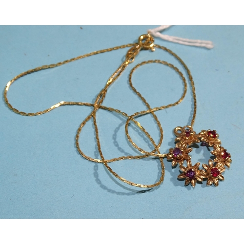 341 - A 9ct gold wreath pendant set six round-cut rubies, on 9ct gold chain, 45cm, 4.4g.