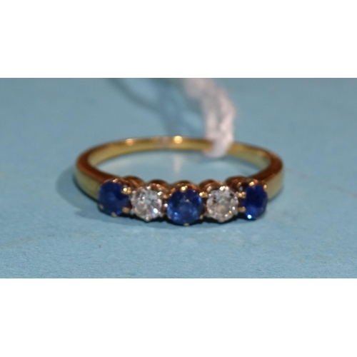 344 - A sapphire and diamond ring claw-set three round-cut sapphires and two brilliant-cut diamonds, in ye... 