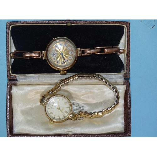 368 - A lady's 9ct-gold-cased wristwatch on 9ct gold sprung bracelet, gross weight 18g, (boxed) and a 9ct-... 