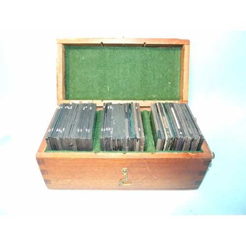 104 - A collection of 54 magic lantern glass slides, including: 24 slides of WWI battleships and submarine... 