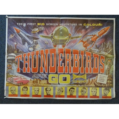 115 - Thunderbirds Are Go (1966), a later printed film poster, folded, 70.5 x 95cm, (drawing pin damage to... 