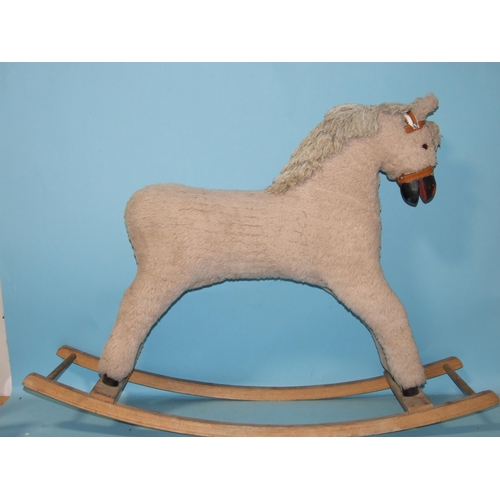 376 - A vintage Mobo metal ride-on horse, (repainted), 76cm high and a plush rocking horse, (2).... 