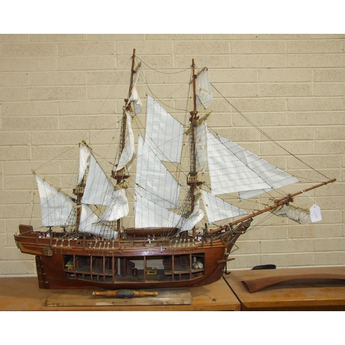 409 - A kit-built wooden model of 'The Bounty' with full masts and rigging, deck detail including figures,... 