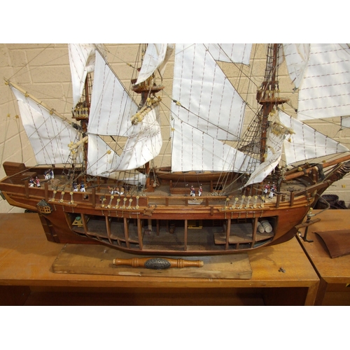 409 - A kit-built wooden model of 'The Bounty' with full masts and rigging, deck detail including figures,... 