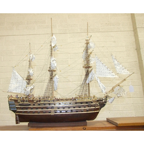 409 - A kit-built wooden model of 'The Bounty' with full masts and rigging, deck detail including figures,... 