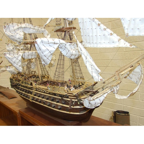 409 - A kit-built wooden model of 'The Bounty' with full masts and rigging, deck detail including figures,... 