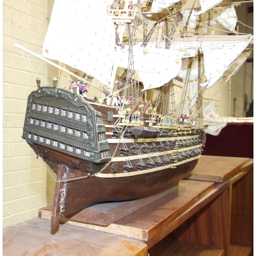 409 - A kit-built wooden model of 'The Bounty' with full masts and rigging, deck detail including figures,... 