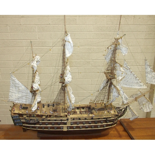 409 - A kit-built wooden model of 'The Bounty' with full masts and rigging, deck detail including figures,... 