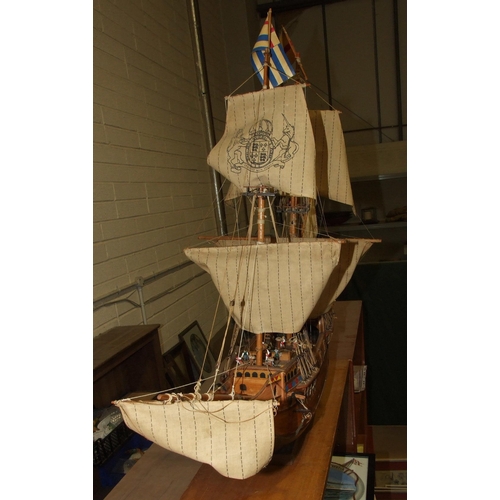 411 - A kit-built wooden model of 'The Mayflower' with full sails, 100cm long, 78cm high.