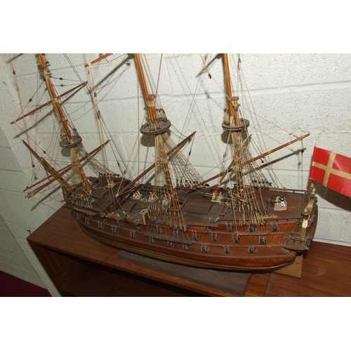 412 - A kit-built wooden model of a three-masted Norse warship, with deck detail including gun crews, 105c... 