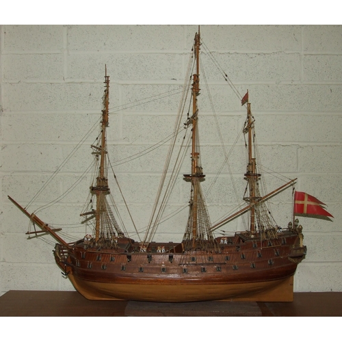 412 - A kit-built wooden model of a three-masted Norse warship, with deck detail including gun crews, 105c... 