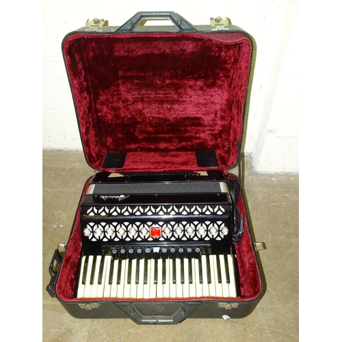 514 - A Baile 120 Bass piano accordion, in case and a modern concertina, in case, (2).