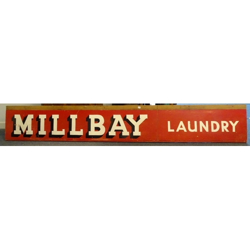 525 - A Millbay Laundry sign, painted wood, 38 x 254cm.