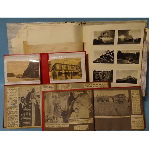 82 - An album of approximately 70 loose topographical postcards and an album of stuck-down postcards and ... 