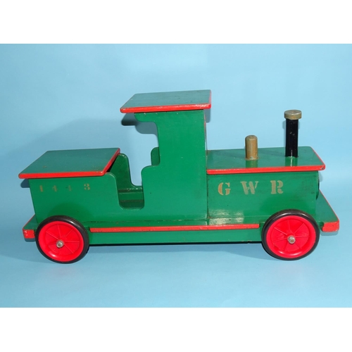 379 - A scratch-built fort with drawbridge, 48 x 63 x 27cm and a ride-on wooden GWR train, 60.5cm long, (2... 