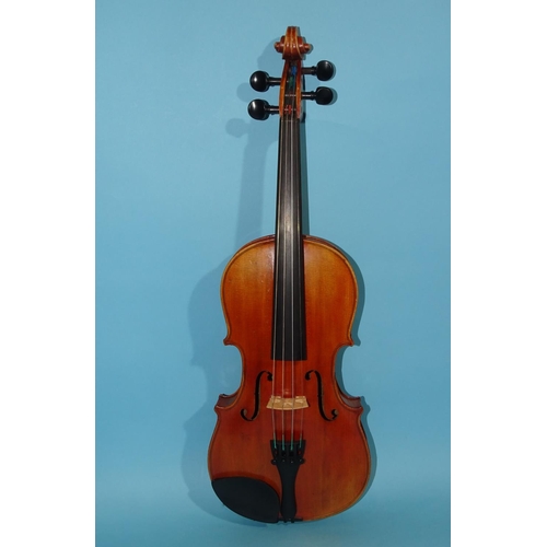 518 - A 20th century ¾-size violin Stradivarius label, with bow, in case.