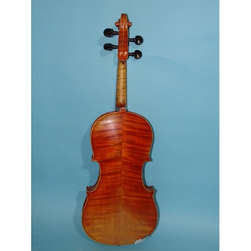 518 - A 20th century ¾-size violin Stradivarius label, with bow, in case.