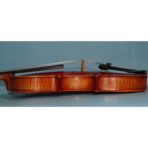 518 - A 20th century ¾-size violin Stradivarius label, with bow, in case.