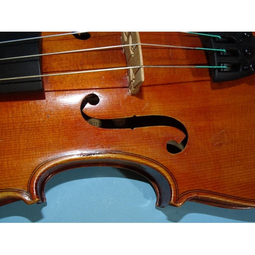 518 - A 20th century ¾-size violin Stradivarius label, with bow, in case.