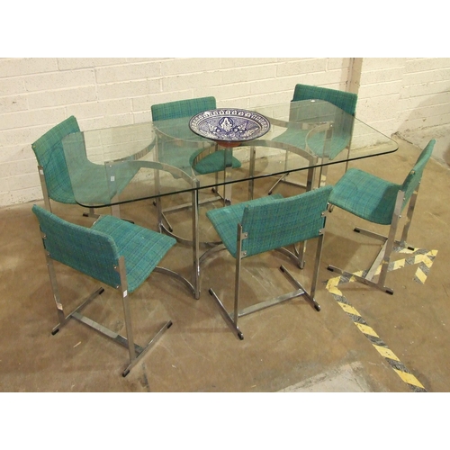 112 - A 1970's plate glass and chrome dining table, the plate glass top with rounded corners, on seven sup... 