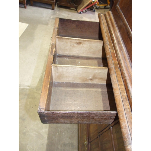 115 - An early-18th century walnut press cupboard, the moulded cornice above two panelled doors, the lower... 