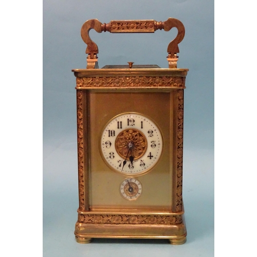 123 - A 19th century French brass repeating carriage clock, the matted and decorative gilt dial with ename... 