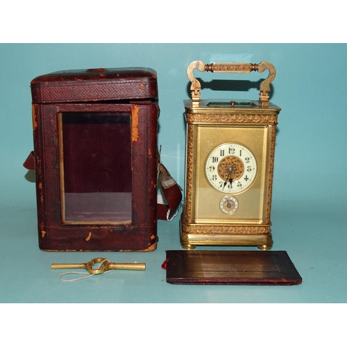 123 - A 19th century French brass repeating carriage clock, the matted and decorative gilt dial with ename... 