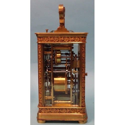 123 - A 19th century French brass repeating carriage clock, the matted and decorative gilt dial with ename... 