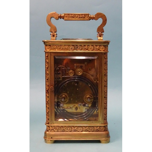 123 - A 19th century French brass repeating carriage clock, the matted and decorative gilt dial with ename... 