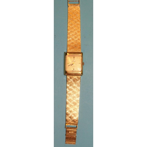 175 - Omega, De Ville Automatic, a ladies' gold-plated wrist watch, the gilt face with baton numerals, the... 