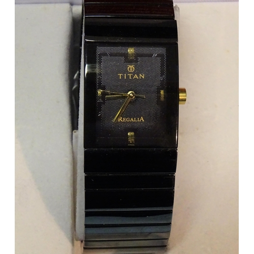 188 - A gentleman's Titan Regalia quartz wrist watch, (boxed with papers).