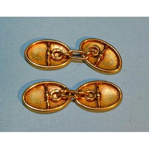 298 - A pair of oval gold cufflinks, (tests as 18-22ct), 11.9g.