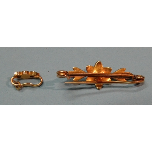 377 - A small pearl-set floral brooch, unmarked, (tests as 15ct approximately), 3.4g and a gold bale set a... 