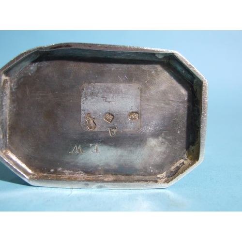 571 - A George I silver tea caddy of rectangular shape with chamfered corners, sliding top with finialled ... 