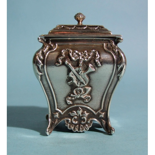 572 - A late-Victorian rectangular tea caddy of bombe shape, embossed with ribbon-tied musical instruments... 