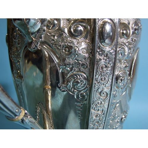 588 - A Victorian silver coffee pot of urn shape, decorated with flowers and scrolls, with beaded rims, on... 