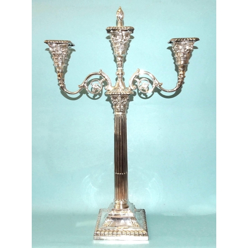 589 - A pair of late-Victorian silver three-branch candelabra, on Corinthian columns and square loaded bas... 