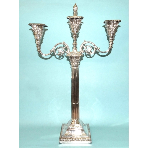 589 - A pair of late-Victorian silver three-branch candelabra, on Corinthian columns and square loaded bas... 