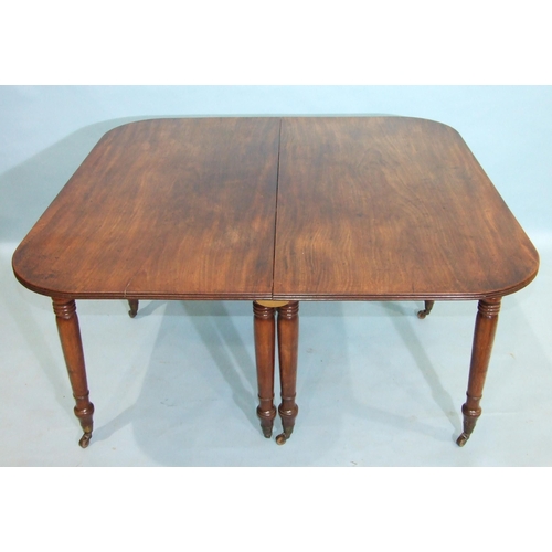 65 - A George III mahogany D-end dining table, the top with pull-out action, on eight turned legs, 287.5 ... 