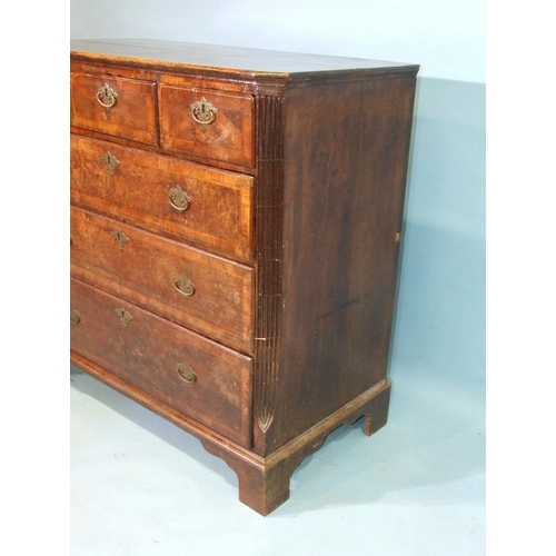 75 - An early-18th century feather-banded walnut chest of three short and three long graduated drawers, w... 