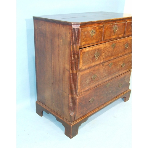 75 - An early-18th century feather-banded walnut chest of three short and three long graduated drawers, w... 