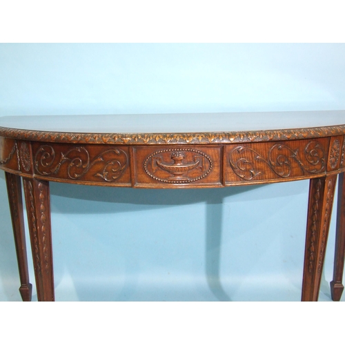 83 - An Adams-style mahogany serpentine serving table of long narrow form, the top with beaded borders ab... 