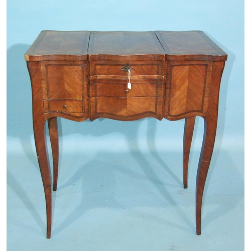 84 - A late-19th century Continental ladies' dressing table of serpentine outline, the top with fold-out ... 