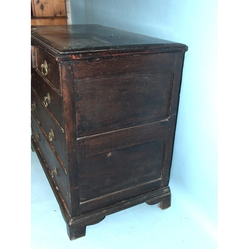 85 - An antique oak chest of two short and three long drawers, on bracket feet, with later softwood top, ... 