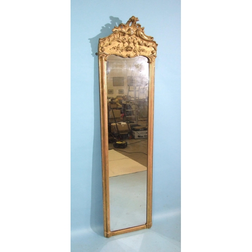 98 - A 19th century tall gilt pier mirror, the moulded frame surmounted by Chippendale-style gesso decora... 