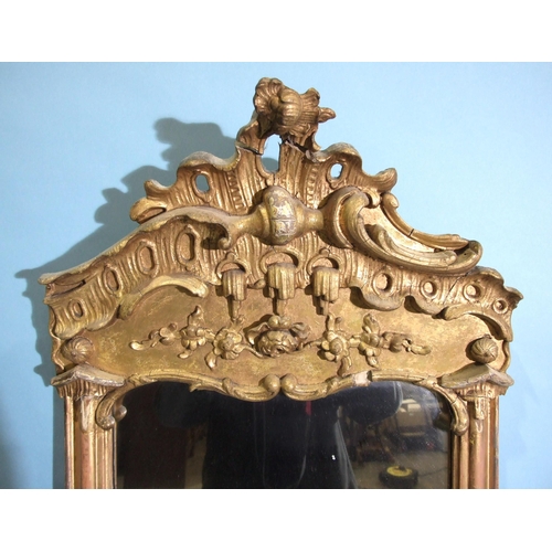 98 - A 19th century tall gilt pier mirror, the moulded frame surmounted by Chippendale-style gesso decora... 